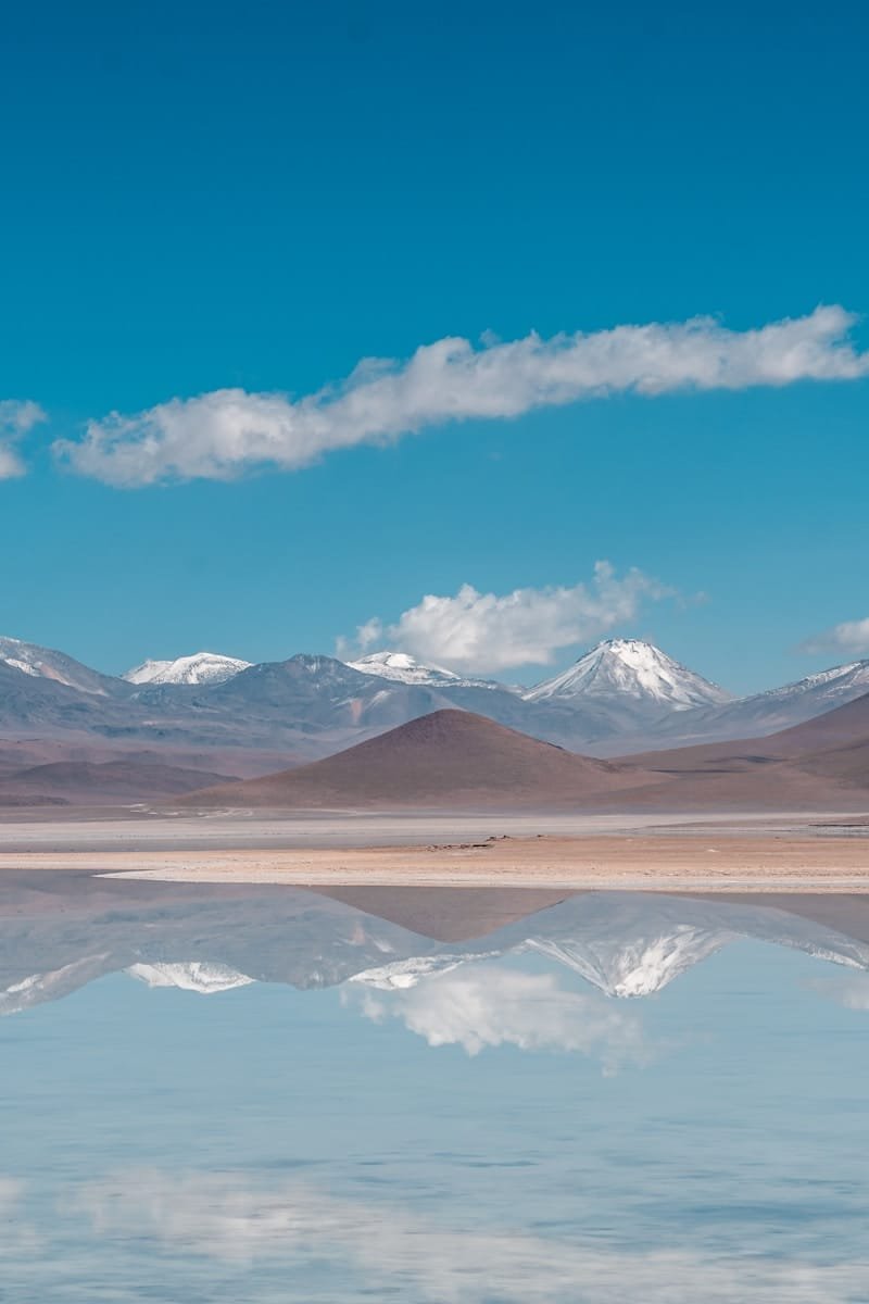 A large body of water with mountains in the background